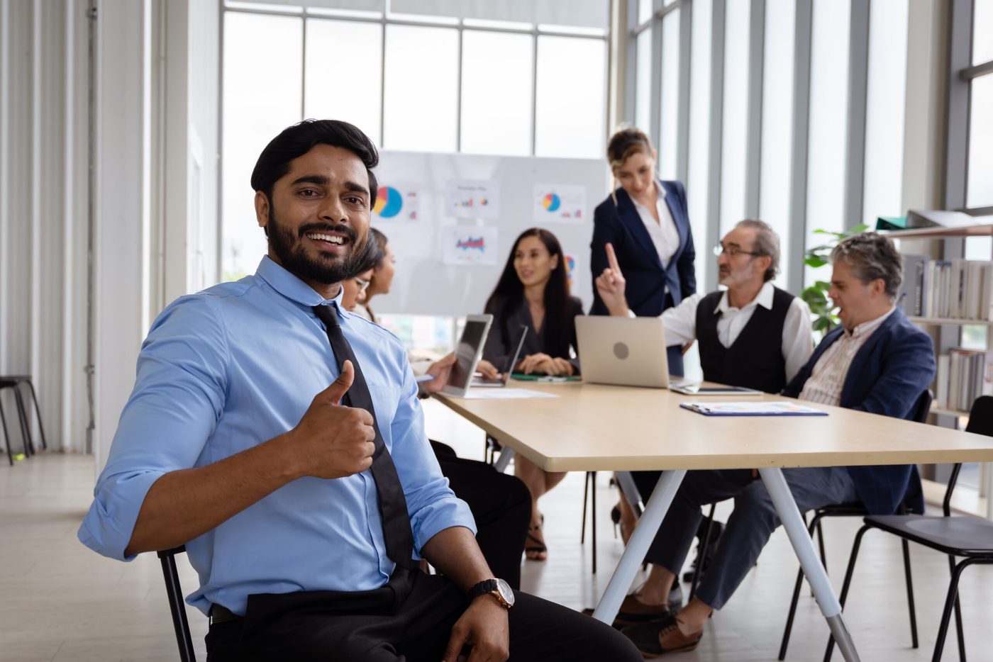 Alinetech consultants in a client meeting